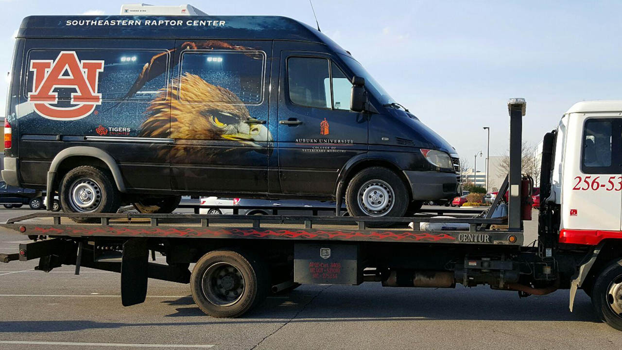 Raptor Center van being towed