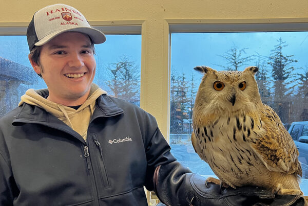 Gabe Hallmark holding an owl.